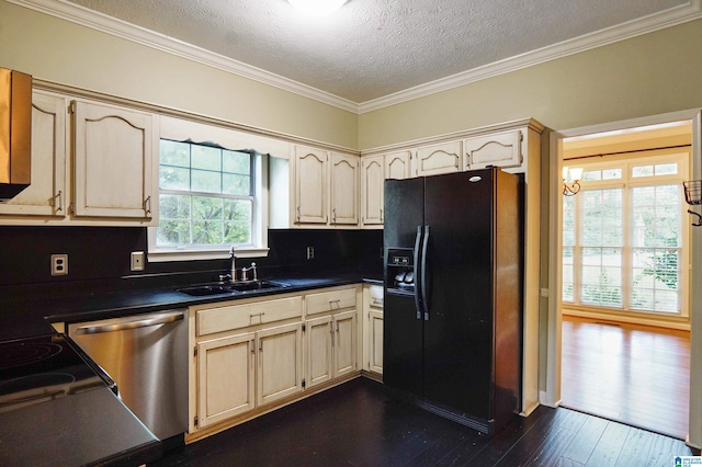 kitchen with dishwasher, sink, black fridge, dark hardwood / wood-style flooring, and a textured ceiling