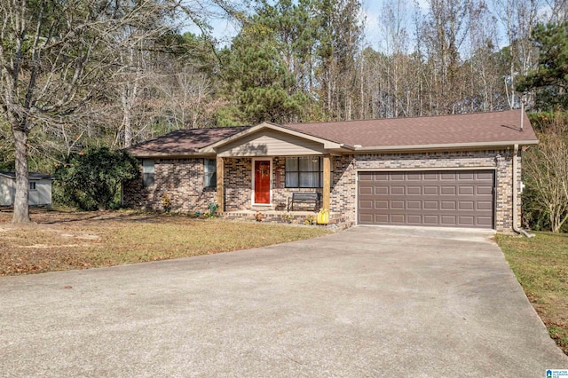 single story home featuring a garage and a front lawn