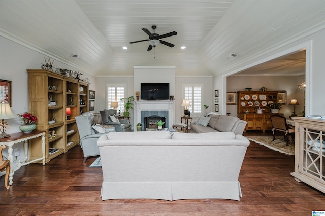 living room with a healthy amount of sunlight, dark hardwood / wood-style flooring, and wood ceiling