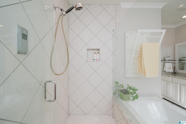 bathroom with plus walk in shower, vanity, and crown molding