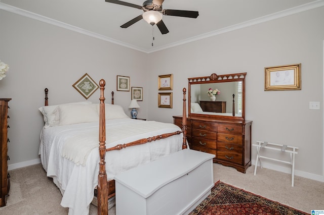 carpeted bedroom featuring ceiling fan and ornamental molding