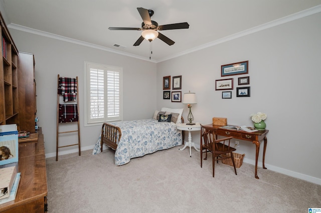 bedroom with ceiling fan, crown molding, and carpet