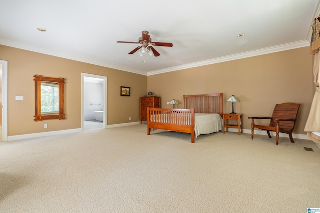 carpeted bedroom featuring ensuite bath, ceiling fan, and crown molding