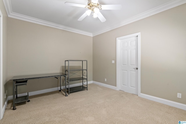 unfurnished room with ceiling fan, light colored carpet, and crown molding