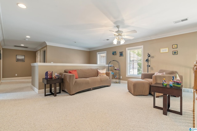 living room featuring light colored carpet, ceiling fan, and crown molding