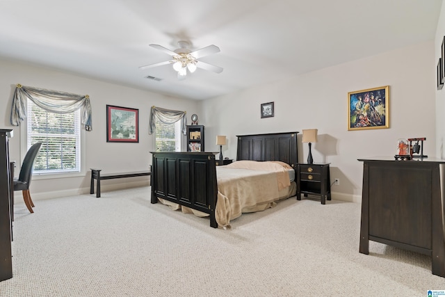 bedroom with light carpet and ceiling fan