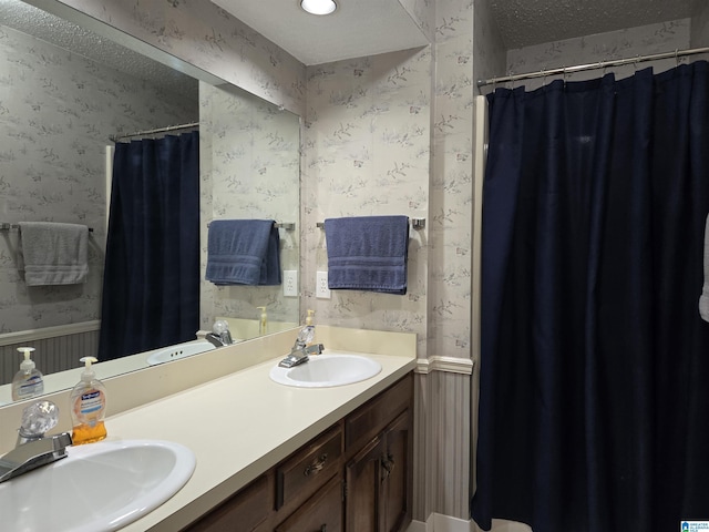 bathroom featuring vanity and a textured ceiling