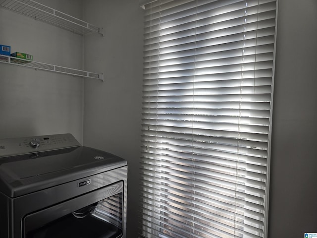 clothes washing area featuring washer / clothes dryer