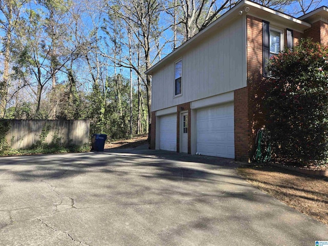 view of side of home with a garage