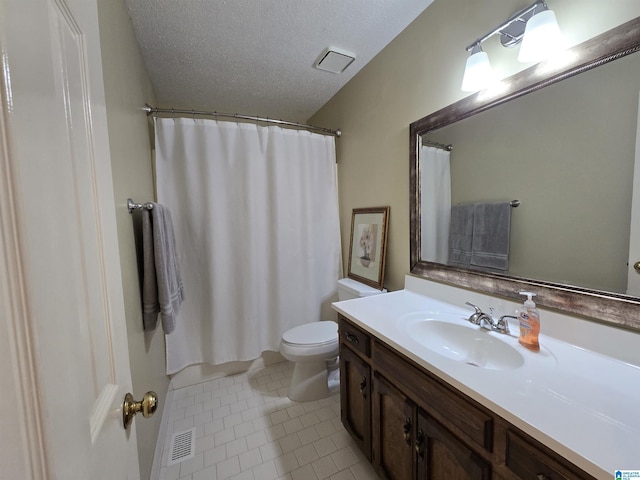 bathroom featuring curtained shower, tile patterned floors, a textured ceiling, toilet, and vanity