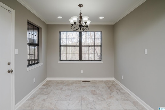 unfurnished dining area with an inviting chandelier and ornamental molding