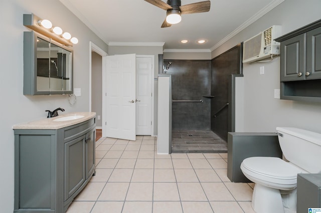 bathroom with ceiling fan, tile patterned floors, toilet, vanity, and ornamental molding