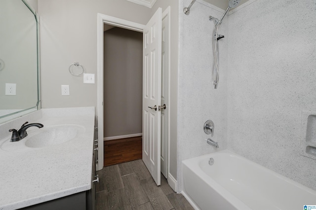 bathroom featuring vanity, shower / bathtub combination, and ornamental molding