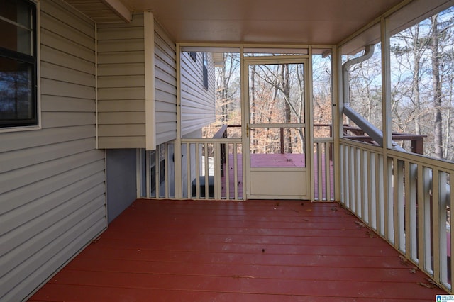 unfurnished sunroom with plenty of natural light