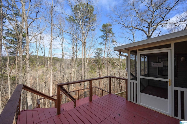 wooden terrace featuring a sunroom