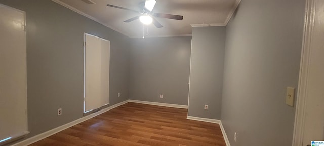 empty room with crown molding, ceiling fan, and wood-type flooring