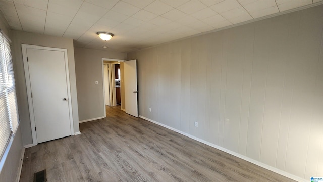 spare room featuring light wood-type flooring