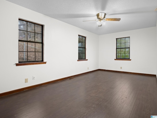 empty room featuring hardwood / wood-style flooring, ceiling fan, and a textured ceiling