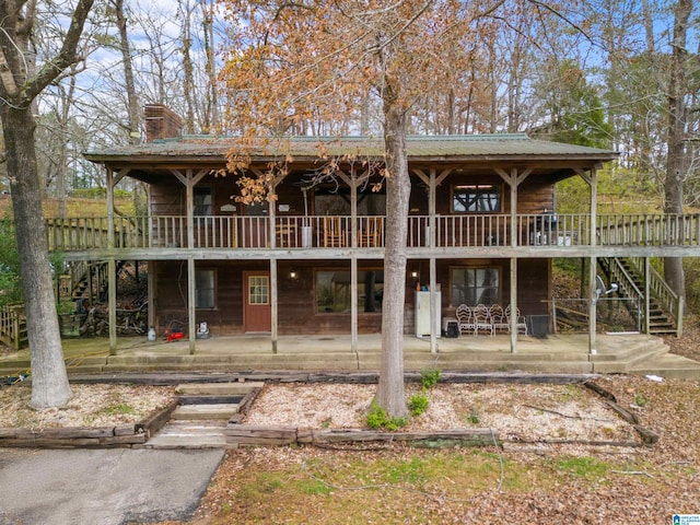 view of front of property with a patio and a deck