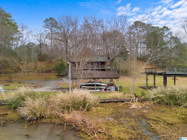 view of yard featuring a deck with water view