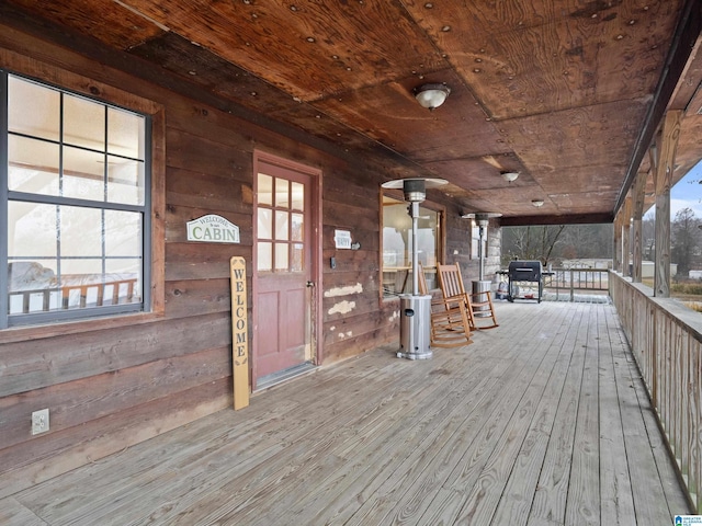 deck featuring area for grilling and a porch