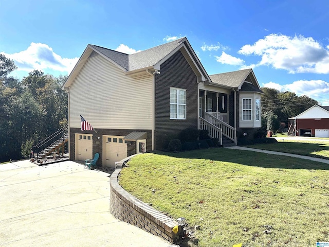 view of front of home with a garage and a front lawn