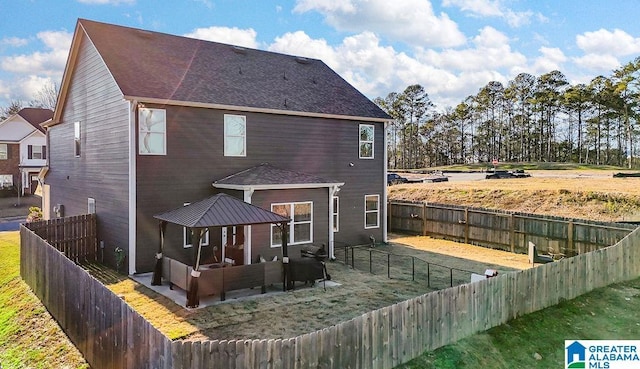 back of property featuring outdoor lounge area and a patio