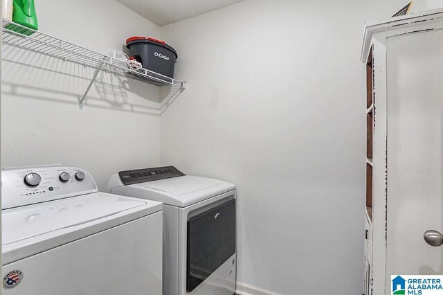 laundry room featuring washing machine and clothes dryer