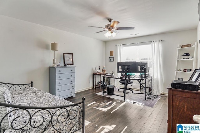 bedroom featuring dark hardwood / wood-style flooring and ceiling fan