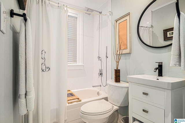 full bathroom featuring shower / bath combo, vanity, and toilet