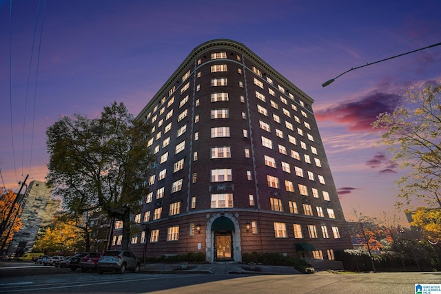 view of outdoor building at dusk