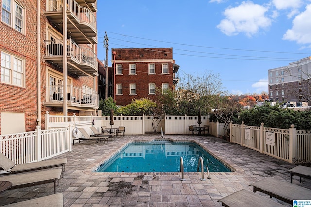 view of swimming pool with a patio area