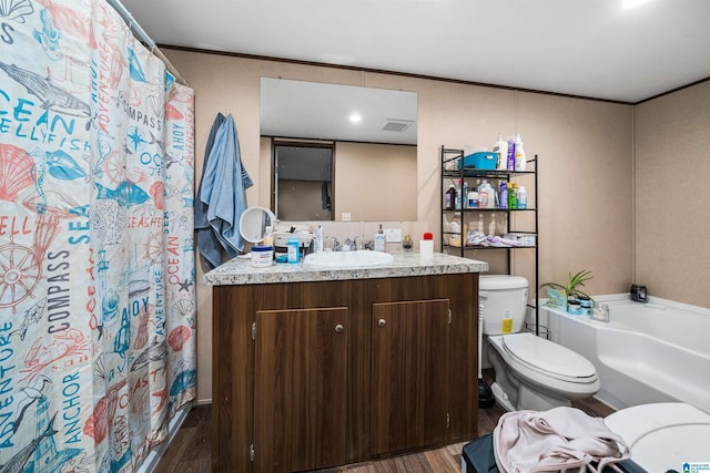 bathroom with hardwood / wood-style floors, vanity, toilet, and crown molding