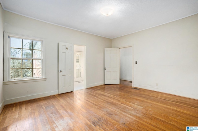 unfurnished bedroom with light hardwood / wood-style flooring