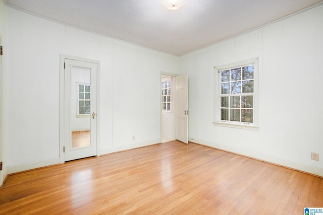 spare room featuring light hardwood / wood-style floors