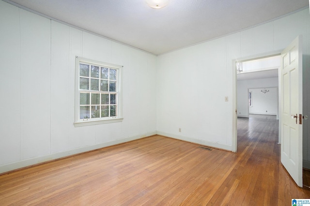 spare room with hardwood / wood-style flooring