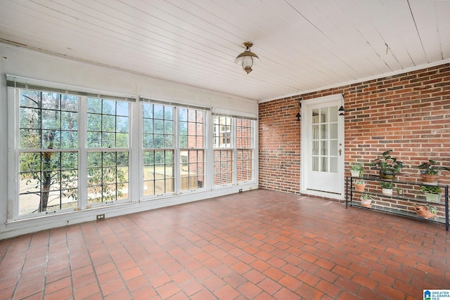 unfurnished sunroom featuring a healthy amount of sunlight