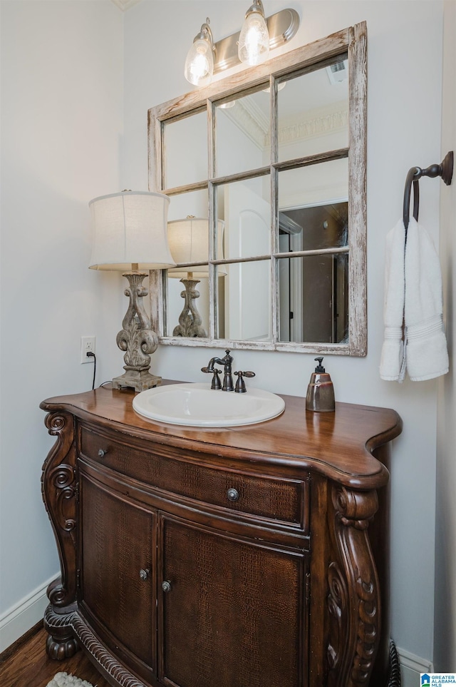 bathroom with vanity and hardwood / wood-style flooring