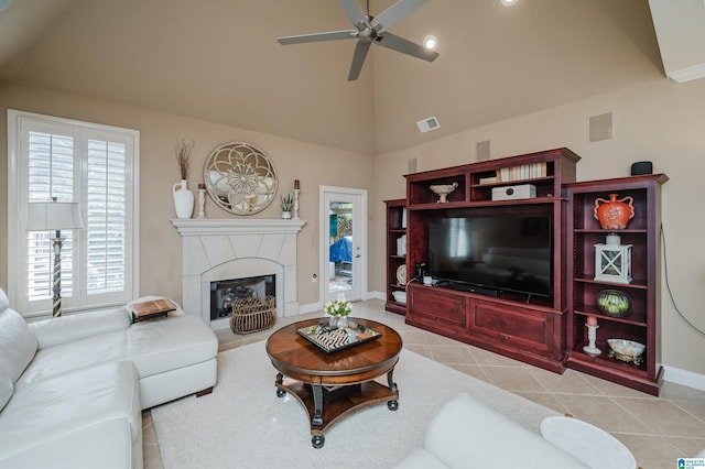 living room with light tile patterned floors, high vaulted ceiling, and ceiling fan