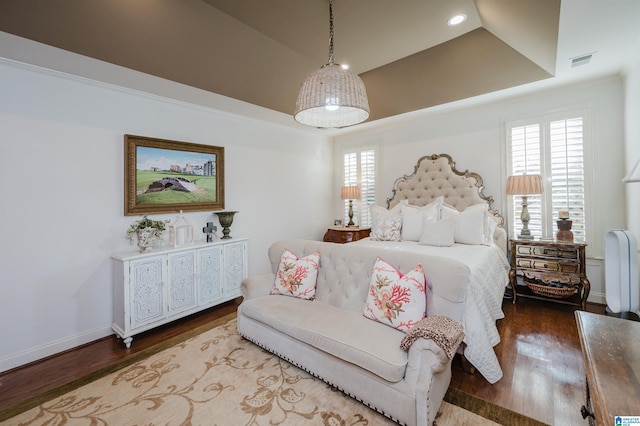 bedroom with hardwood / wood-style floors