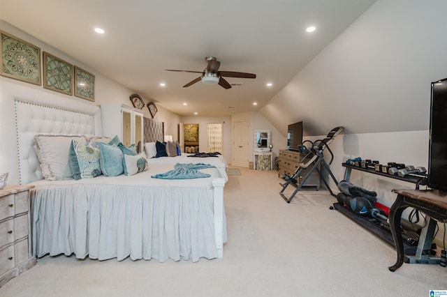 carpeted bedroom with ceiling fan and lofted ceiling