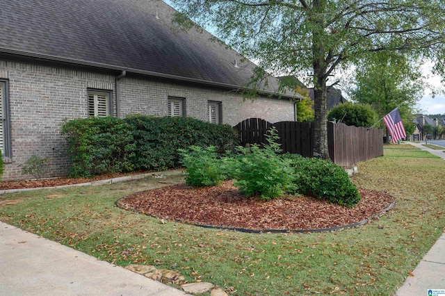 view of side of property featuring a yard