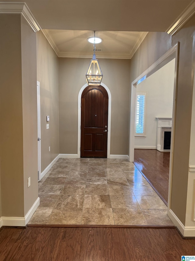 entrance foyer featuring ornamental molding