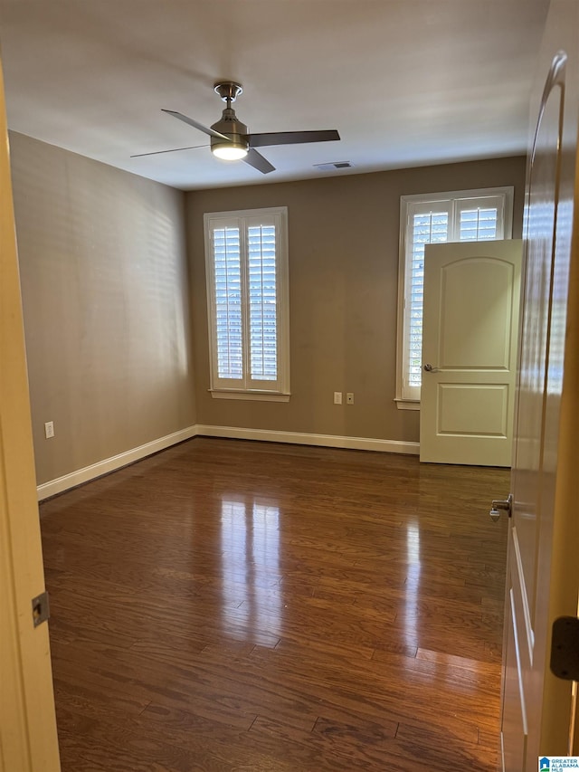 interior space featuring dark hardwood / wood-style floors and ceiling fan