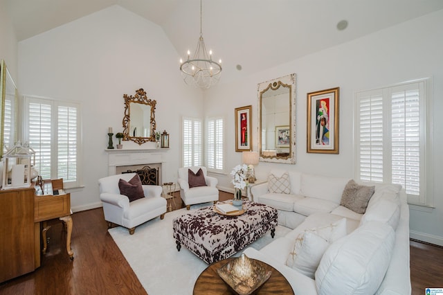 living room featuring lofted ceiling, dark wood-type flooring, and a chandelier