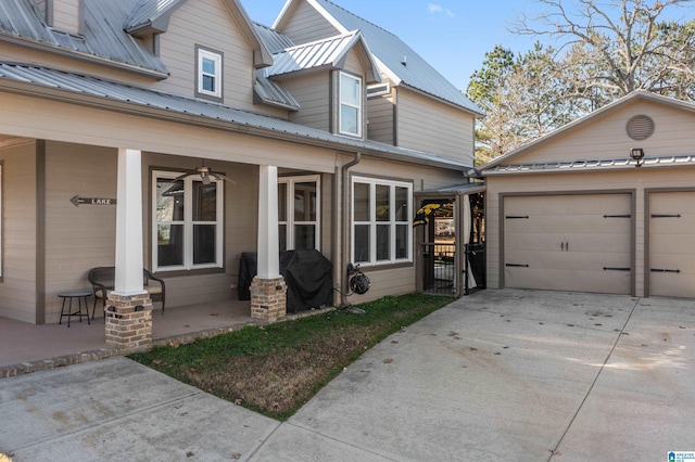 view of front of property with a garage and an outdoor structure