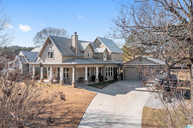 view of front of home with a porch and a garage