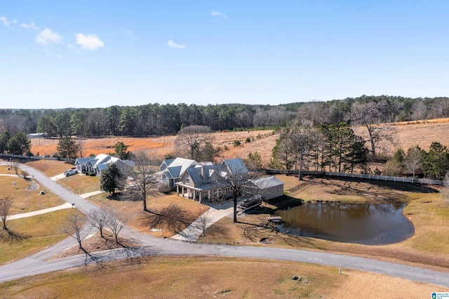 birds eye view of property with a rural view and a water view