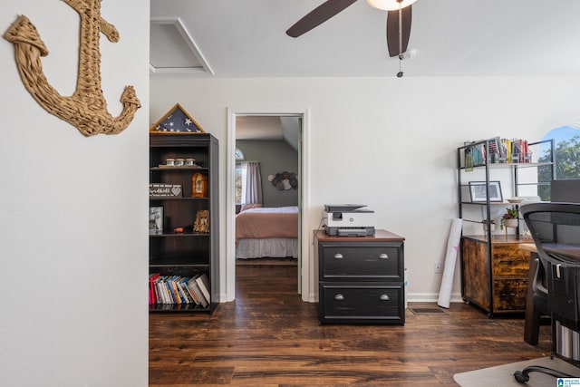 home office with ceiling fan and dark hardwood / wood-style flooring