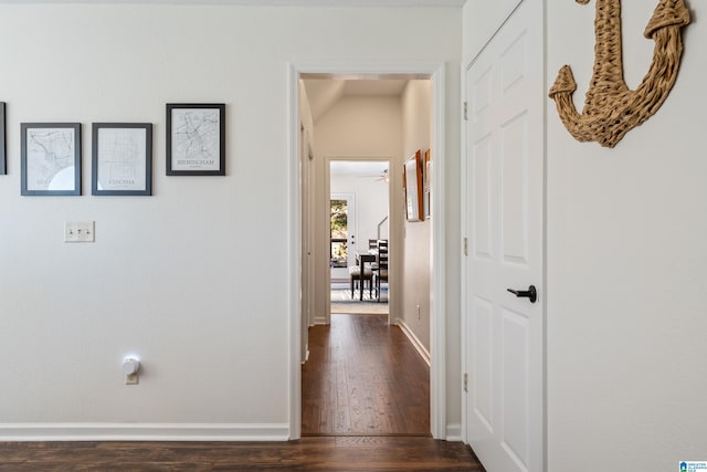 hallway with dark hardwood / wood-style floors